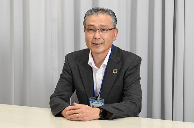 画像：株式会社明文堂 専務取締役 明石 英一 様